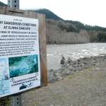 A warning sign near the entrance to Olympic National Park alerts rafters and kayakers to underwater dangers along the course of the Elwha River, remnants of the removal of the Glines Canyon and Elwha dams. (Keith Thorpe/Peninsula Daily News)