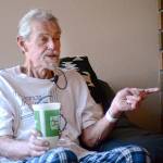 Richard Jones, 69, talks to reporters in his Sequim-area home Monday after being rescued from his car earlier that morning. He was trapped in his car for five days. (Jesse Major/Peninsula Daily News)