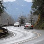 Cars make their way around a curve on U.S. Highway 101 at Lake Crescent west of Port Angeles on Wednesday. (Keith Thorpe/Peninsula Daily News)