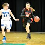 Al Camp/Omak-Okanogan County Chronicle                                Neah Bay&rsquo;s Cei&rsquo;J Gagnon brings the ball up against Colton&rsquo;s Meghan Devorak in the Red Devils&rsquo; second-round state 1B tournament game Thursday.