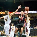 Al Camp/Omak Chronicle Neah Bay&rsquo;s Kenrick Doherty Jr. lays up a shot while defended by Sunnyside Christian&rsquo;s Luke Wagenaar during the Red Devils&rsquo; 58-48 loss to the Knights at Spokane Arena.
