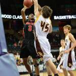 Neah Bay&rsquo;s Anthony Bitegeko shoots over the outstretched arm of Sunnyside Christian&rsquo;s Kyler Marsh during the Red Devils&rsquo; 58-48 loss to the Knights at Spokane Arena. (Al Camp/Omak Chronicle)