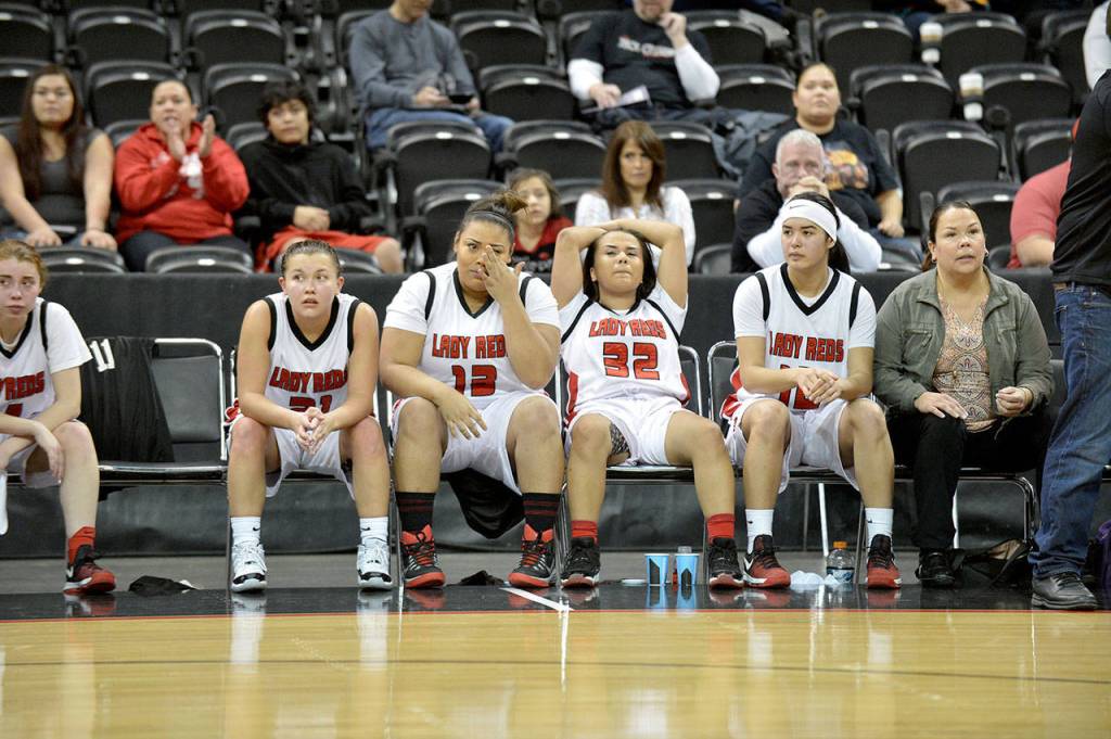 Al Camp/Omak Chronicle Neah Bay players from left, Gina McCaulley (white/black shoes), Brianne Jimmicum, Starlena Halttunen and Vonte Aguirre react in the latter moments of the Red Devils&rsquo; 60-57 loss to Tacoma Baptist in the Class 1B girls basketball state tournament Friday at Spokane Arena.
