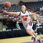 Al Camp/Omak Chronicle Neah Bay&rsquo;s Vonte Aguirre reaches for a loose ball during the Red Devils&rsquo; 60-57 loss to Tacoma Baptist in the Class 1B girls basketball state tournament Friday at Spokane Arena.