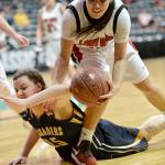 Al Camp/Omak Chronicle Neah Bay&rsquo;s Vonte Aguirre scraps with Tacoma Baptist&rsquo;s Emily Young during the Class 1B girls basketball state tournament Friday at Spokane Arena.