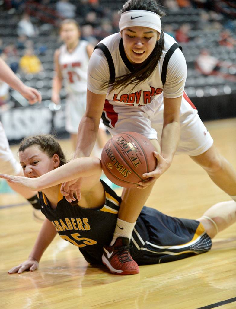 Al Camp/Omak Chronicle Neah Bay&rsquo;s Vonte Aguirre scraps with Tacoma Baptist&rsquo;s Emily Young during the Class 1B girls basketball state tournament Friday at Spokane Arena.