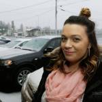 Jessica Wolfe poses for a photo Feb. 27 in the doorway of The Genesis Project, a drop-in center in SeaTac for victims of sex trafficking. (Ted S. Warren/The Associated Press)