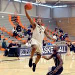 Rick Ross/Peninsula College                                Peninsula&rsquo;s Darrion Daniels, left, drives to the rim past a Portland defender during the Pirates&rsquo; 70-62 victory during the first round of the NWAC Men&rsquo;s Basketball Tournament on Thursday at Everett Community College.