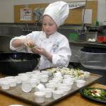 Keith Thorpe/Peninsula Daily News                                Nine-year-old Zoe Leffers, a fourth-grade student at Hamilton School in Port Angeles, creates a healthy salad Friday in the Port Angeles School District kitchen as part of the 2017 Sodexo Future Chefs Challenge. The event, part of a national initiative to promote healthy eating, brought together student teams from five Port Angeles elementary schools in a competition to cook up culinary creations with the theme of &ldquo;Healthy Comfort Foods.&rdquo;