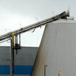 A conveyor belt hangs loose from the bottom of its track after a fire at the Nippon Paper Industries USA mill in Port Angeles on Friday. (Keith Thorpe/Peninsula Daily News)