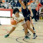 Rick Ross/Peninsula College                                Peninsula&rsquo;s Taisha Thomas looks to pass against Tacoma in Peninsula&rsquo;s 69-61 opening round win in the NWAC Tournament.