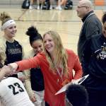 Rick Ross/Peninsula College                                Peninsula head coach Allison Crumb congratulates her team on winning its opening round game of the NWAC Tournament.