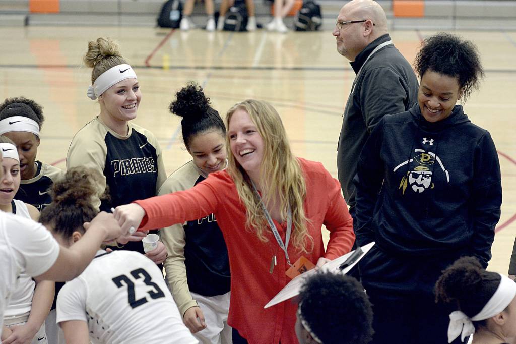 Rick Ross/Peninsula College                                Peninsula head coach Allison Crumb congratulates her team on winning its opening round game of the NWAC Tournament.