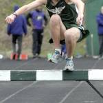 Keith Thorpe/Peninsula Daily News Thomas Shaw of Port Angeles clears an obstacle during the 2k steeplechase on Friday. Shaw was the lone varsity competitor in the event.