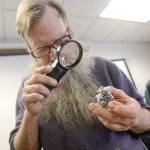 Russell Boggs helps rockhounds identify their &ldquo;mystery&rdquo; rocks during the Port Angeles Parks and Recreation Department&rsquo;s seventh annual Rock, Gem & Jewelry Show on Sunday. (Jesse Major/Peninsula Daily News)