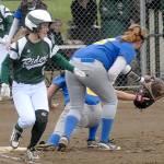 Keith Thorpe/Peninsula Daily News                                Port Angeles&rsquo; Sierra Robinson beats the throw to Bremerton first baseman Cyrah Bias backed by second baseman Lissa Joiner, right, in the first inning of the Roughriders&rsquo; 12-0 shutout of the Knights.