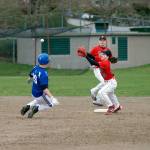 Steve Mullensky/for Peninsula Daily News                                Chimacum&rsquo;s Bruce Seton, 19, slides into second base on a successful steal attempt before the ball reaches Port Townsend&rsquo;s Tristan Van Leuven during the Cowboys 7-1 win over the Redhawks at Flint Field in Port Townsend.