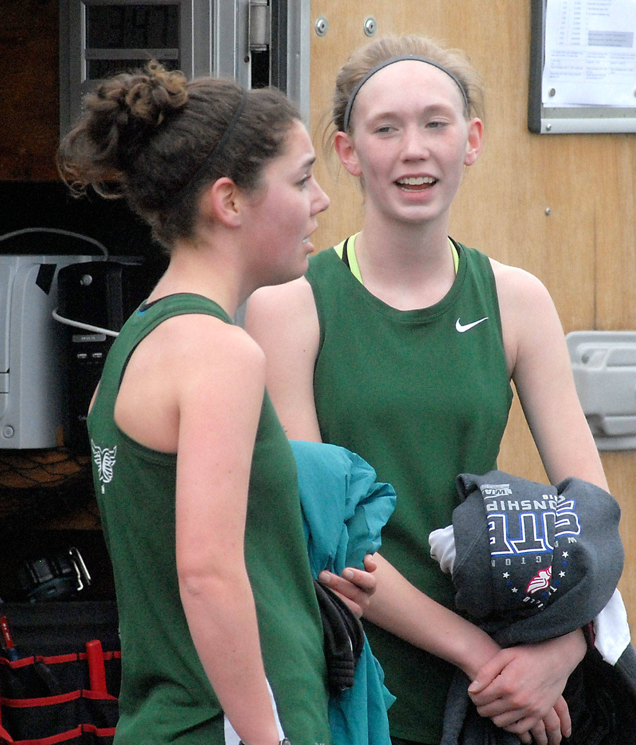 Keith Thorpe/Peninsula Daily News                                Port Angeles&rsquo; Lael Butler, left, and Gracie Long converse at the finish of the girls 3200m race on Thursday at Port Angeles High School. Long won the event with a time of 12:10.30 with Butler taking second at 13:10.45.