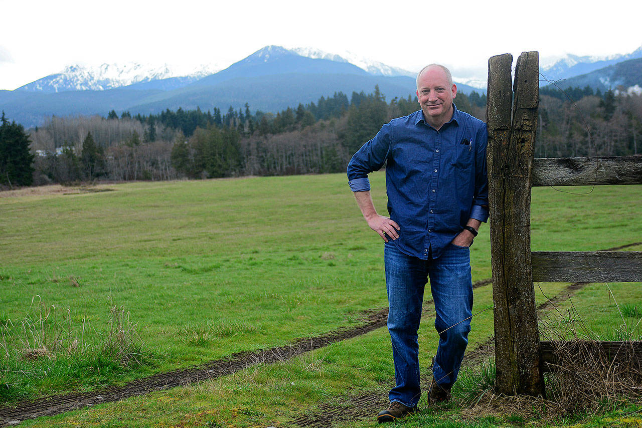 Matthew Rainwater, President of Pennies for Quarters, stands at 1430 W. Lauridsen Blvd., the property he hopes to turn into a community of tiny homes built to help homeless veterans get back on their feet. (Jesse Major/Peninsula Daily News)