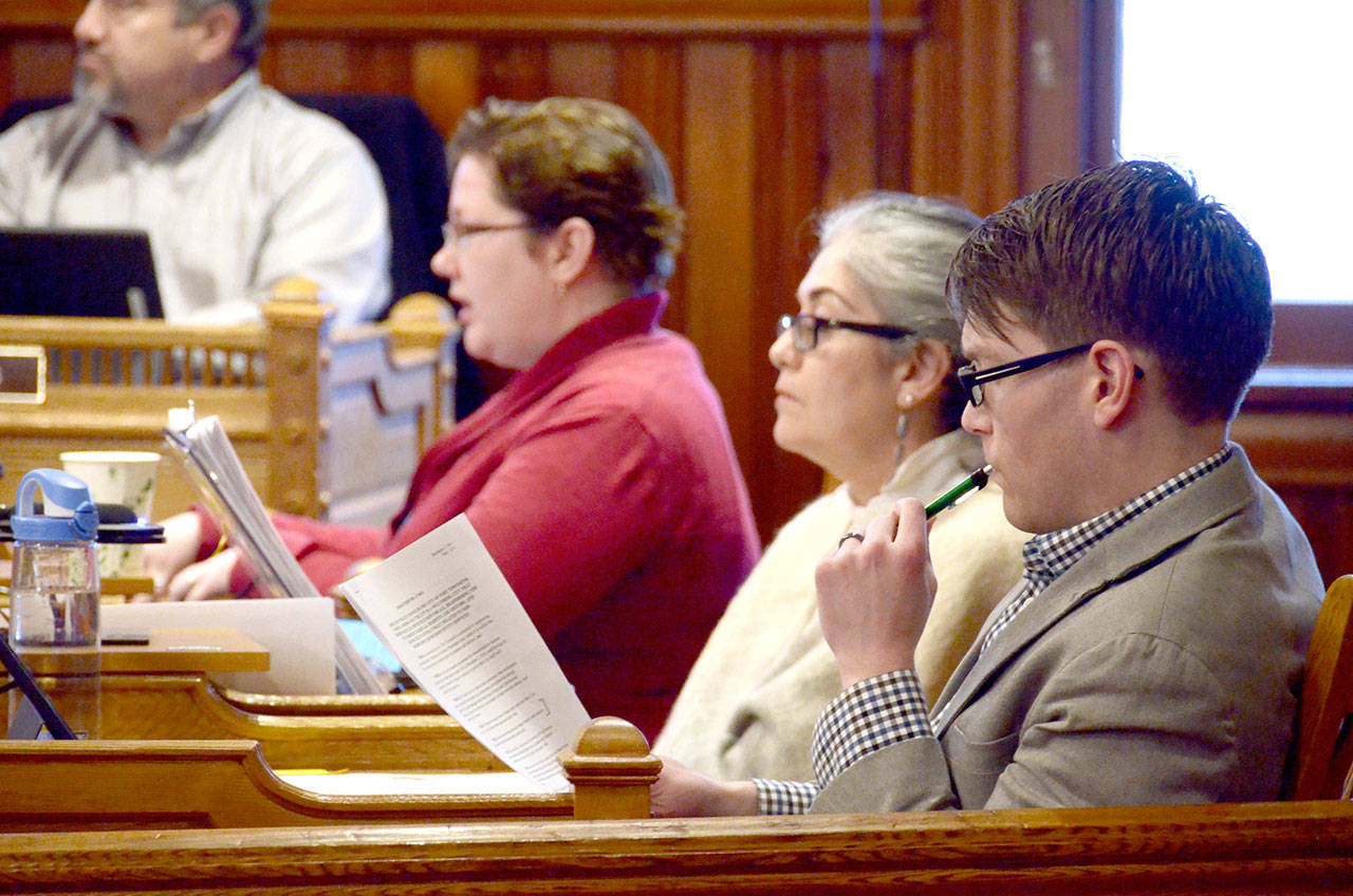 The &ldquo;welcoming city&rdquo; committee, made of up city council members Amy Howard, Michelle Sandoval and David Faber, from left, listen to questions from other council members during Monday&rsquo;s meeting. (Cydney McFarland/Peninsula Daily News)