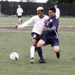 Dave Logan/for Peninsula Daily News                                Sequim&rsquo;s Josiah Urquia, left, and Forks&rsquo; Julio Salazar fight for possession of the ball during the Wolves&rsquo; 9-0 victory over the Spartans at Wally Sigmar Field at Peninsula College.