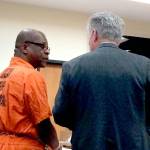 Murder suspect Tommy Ross consults with his attorney, Lane Wolfley of Port Angeles, during a court hearing Tuesday. (Paul Gottlieb/Peninsula Daily News)