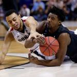 Xavier guard Quentin Goodin, right, grabs a loose ball next to Gonzaga guard Nigel Williams-Goss during the first half of an NCAA Tournament college basketball regional final game Saturday, March 25, 2017, in San Jose, Calif. (AP Photo/Tony Avelar)