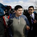 Daniel Ramirez Medina, center, briefly talks to reporters as he walks with his attorney, Luis Cortes, right, after Ramirez was freed from custody at the Northwest Detention Center in Tacoma on Wednesday. (Ted S. Warren/The Associated Press)