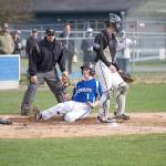 Steve Mullensky/for Peninsula Daily News                                Chimacum&rsquo;s Issac Purser beats the throw and slides across home plate for a run during the Cowboys&rsquo; 7-1 loss to Klahowya.