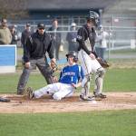 Steve Mullensky/for Peninsula Daily News Chimacum&rsquo;s Issac Purser beats the throw and slides across home plate for a run during the Cowboys&rsquo; 7-1 loss to Klahowya.