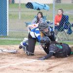Steve Mullensky/for Peninsula Daily News                                Chimacum&rsquo;s Mechelle Nisbet tags out Klahowya&rsquo;s Hannah Bastian at home plate during the Cowboys&rsquo; 5-4 win Friday.