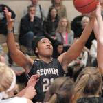 Keith Thorpe/Peninsula Daily News Sequim&rsquo;s Adrienne Haggerty, top, pulls down a rebound in the fourth quarter on Friday while surrounded by, from left, Nizhoni Wheeler and Natalie Steinman of Port Angeles and teammates Bobbi Sparks and Madison Green.