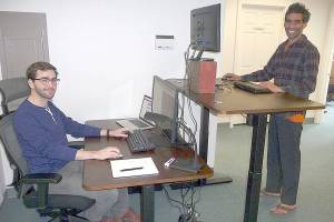 Patricia Morrison Coate/Olympic Peninsula News Group                                Edward Unthank, left, and Ankur Shah, right, display two different work station configurations at Clallam Coworking in Sequim.