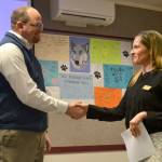 Brian Kuh shakes hands with Robin Henrikson, board president for the Sequim School Board, on Monday after he was sworn in as a new board director. He replaces Bev Horan, who stepped down March 7. (Matthew Nash/Olympic Peninsula News Group)