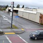 Matthew Nash (2)/Olympic Peninsula News Group                                At left, the view from Sequim VFW shows much of the span of North Sunnyside Avenue where crews this summer will reconstruct the road for new water and sewer pipeline. Below, the right-in, right-out traffic island will remain through construction this summer to prevent traffic collisions, say Sequim city staff, because North and South Sunnyside avenues don&rsquo;t directly align.