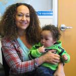 Rachel Dolezal poses for a photo with her son, Langston, in the bureau of the Associated Press in Spokane.(Nicholas K. Geranios/The Associated Press)