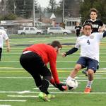 Lonnie Archibald/for Peninsula Daily News Forks&rsquo; Saul Avila, right, competes with Tenino goalkeeper Dylan Billings for the ball during the Spartans&rsquo; 8-0 win over the Beavers at Spartans Stadium. Also in the action is Spartan Samuel Gomez (10) and Tenino&rsquo;s Laitan Jordan (11).