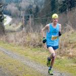 Keith Thorpe/Peninsula Daily News Keith Laverty of Bainbridge Island ascends the last hill towards the finish to win the half marathon of the Olympic Adventure Trail Run on Saturday west of Port Angeles. A total of 282 runners were registered to take part in full and half marathons on a tortuous route along the adventure trail.                                Keith Thorpe/Peninsula Daily News Keith Laverty of Bainbridge Island ascends the last hill towards the finish to win the half marathon of the Olympic Adventure Trail Run on Saturday west of Port Angeles. A total of 282 runners were registered to take part in full and half marathons on a tortuous route along the adventure trail.