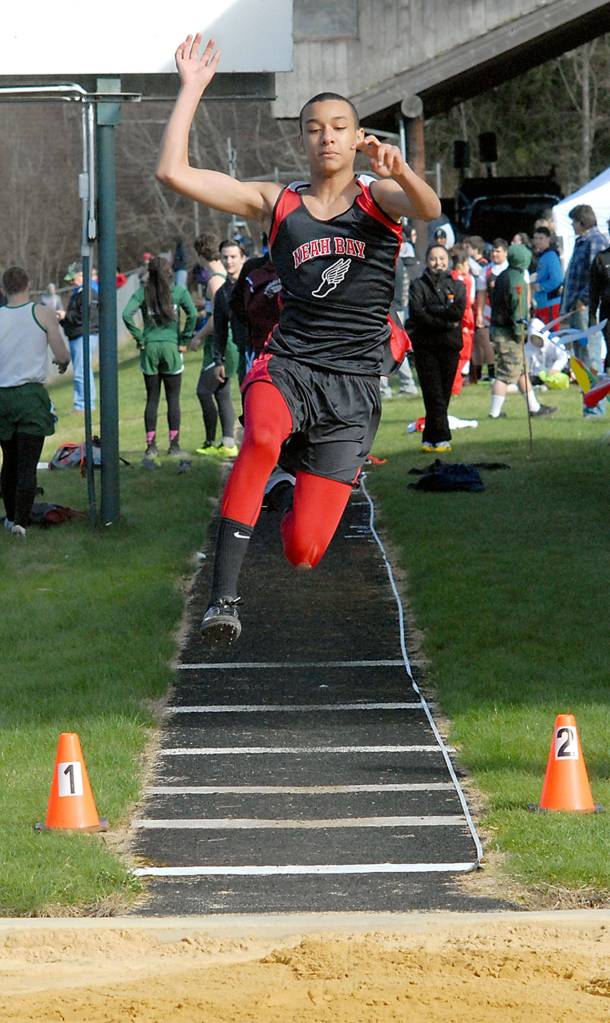 Keith Thorpe/Peninsula Daily News Sean Bitegeko of Neah Bay competes in the long jump during Thursday&rsquo;s meet at Crescent High School in Joyce.