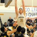 Lonnie Archibald/for Peninsula Daily News Forks&rsquo; Marky Adams sends home a two-hand slam dunk in a nonleague game against North Beach. Adams has been selected as the All-Peninsula Boys Basketball MVP in a vote of area coaches and the sports staff of the Peninsula Daily News.