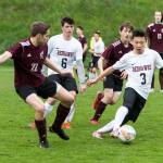 Steve Mullensky/for Peninsula Daily News                                Port Townsend&rsquo;s Aaron Lee, boots the ball away from Ketchikan&rsquo;s Brent Taylor during a friendly game at Memorial Field in Port Townsend.