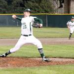 By Dave Logan/for Peninsula Daily News Port Angeles pitcher Ethan Flodstrom, backed up by first baseman Colton McGuffey, throws a pitch against the Bremerton Knights.