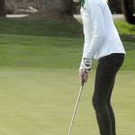 Keith Thorpe/Peninsula Daily News Tana Hiigel of Port Angeles putts on the first hole at the Cedars at Dungeness near Sequim on Wednesday.