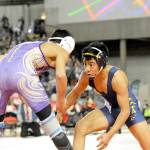 Lonnie Archibald/for Peninsula Daily News                                Forks&rsquo; Josue Lucas, right, was the lone state champion from the North Olympic Peninsula at Mat Classic in the Tacoma Dome. Lucas, wrestling as a 106-pounder, went 35-4 on the season with regional and sub-regional titles.