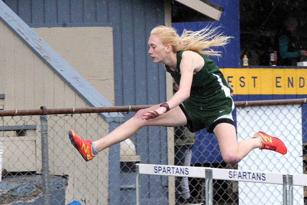 Lonnie Archibald/for Peninsula Daily News Gracie Long of Port Angeles won the 300-meter hurdles as the Roughrider girls did well in the intermediate and long-distance events.