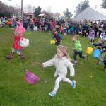 Youngsters race from the starting area to collect prize-filled eggs during Saturday&rsquo;s 39th annual KONP Easter Egg Hunt at the Clallam County Fairgrounds in Port Angeles. Hundreds of children took part in the event, traditionally the biggest egg hunt on the North Olympic Peninsula. (Keith Thorpe/Peninsula Daily News)