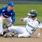 Keith Thorpe/Peninsula Daily News Chimacum shortstop Issac Purser, left, looks at Port Angeles&rsquo; Anthony Quinones after tagging him out on a steal attempt in the third inning on Friday at Volunteer Field in Port Angeles.