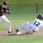 Steve Mullensky/for Peninsula Daily News Port Townsend second baseman Robert Hammett catches the relay throw but is too late to get the out on Klahowya&rsquo;s Nathan Mjhor in a Friday game played in Port Townsend. The Eagles shutout the Redhawks 13-0.