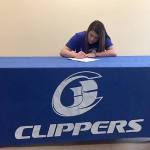 Neah Bay senior Tristin Johnson signs her letter of intent to play for the South Puget Sound Community College women&rsquo;s basketball team.