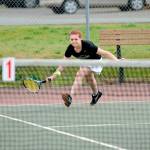Matthew Nash/ Olympic Peninsula News Group Sequim&rsquo;s Stephanie LaCour scoops up the ball to save a shot against Port Angeles&rsquo; Summer Olsen on Wednesday. LaCour and the Wolves swept the Roughriders 7-0.